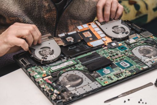 a-computer-repair-specialist-disassembles-and-clea-2022-01-14-23-23-44-utc a-computer-repair-specialist-disassembles-and-clea-2022-01-14-23-23-44-utc
